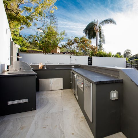 Cook up a feast in the summer kitchen and dine alfresco