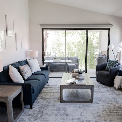 Step from the bright living space onto the private balcony in moments