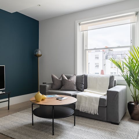 Relax in a stylish living space with plenty of natural light