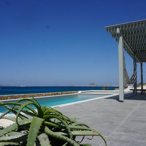 Drink in the sea views from the stylish sun terraces and hammock