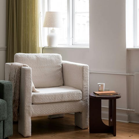 Unwind with a glass of wine in the comfy armchair