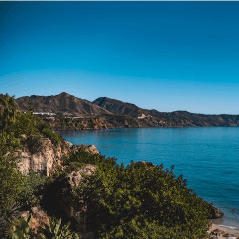Bask in the warm sunshine on Carabeillo Beach, a short stroll from your building