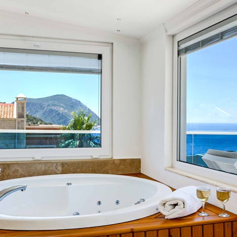 Unwind in the jacuzzi bathtub after a day on the beach