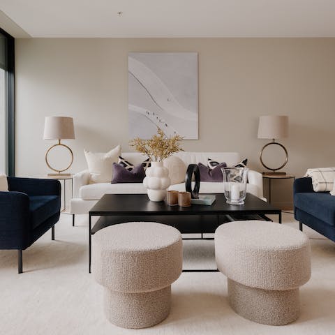 Relax in the apartment's living room, with its effortless Scandinavian style