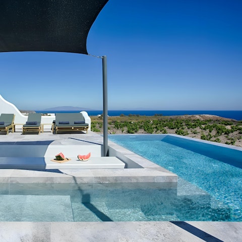 Take in the stunning views of the Aegean Sea from the pool