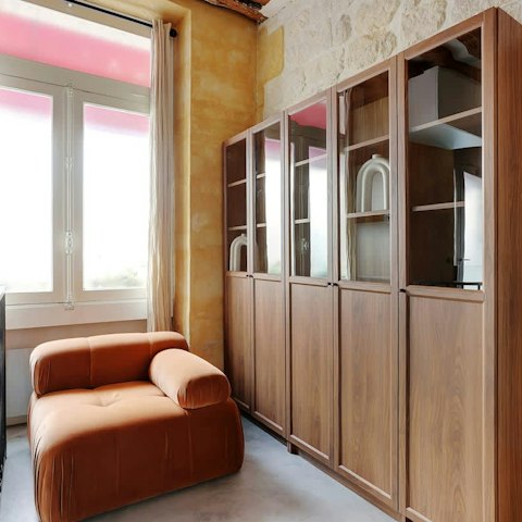 Curl up with a book by the window before strolling to the Louvre