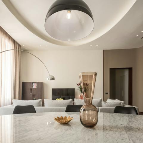 Sit down around the elegant dining table for some home cooked pasta