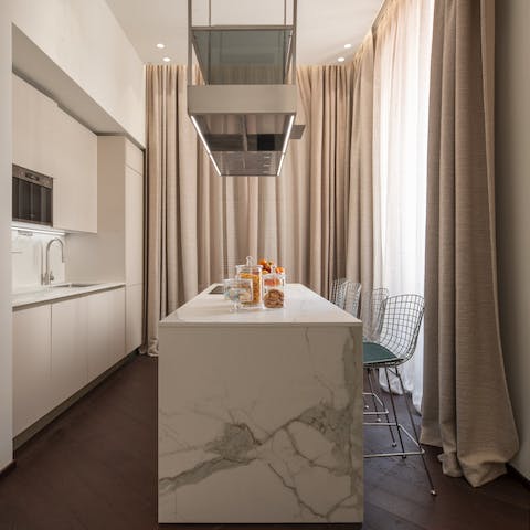 Start mornings with a coffee at the sleek kitchen island before setting off