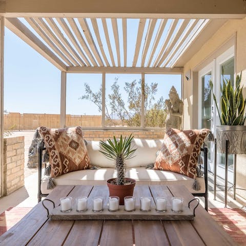 Make the comfy terrace area your go-to place for pre-dinner cocktails