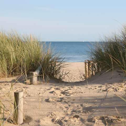 Sink your feet into the sand at West Wittering beach, a short drive away