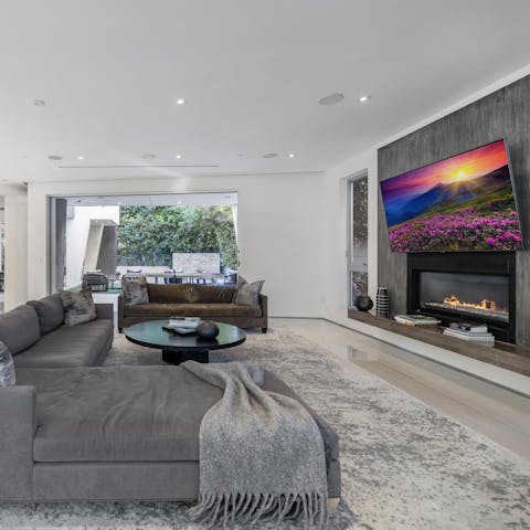 Curl up on the sofa and spend cosy evenings reading a book as the fire flickers away in the background