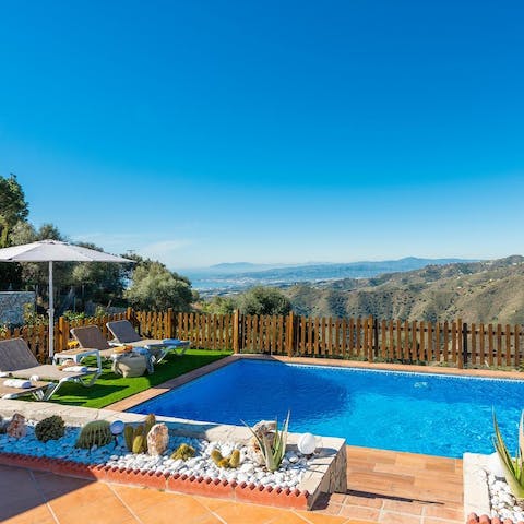 Relax by the pool as you admire the view