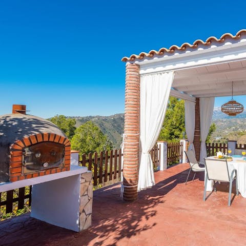 Tuck into a homemade pizza on the terrace