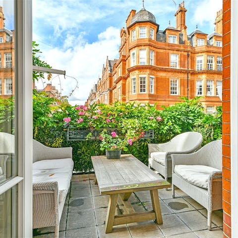 Enjoy a glass of wine out on the private terrace after a day of sightseeing