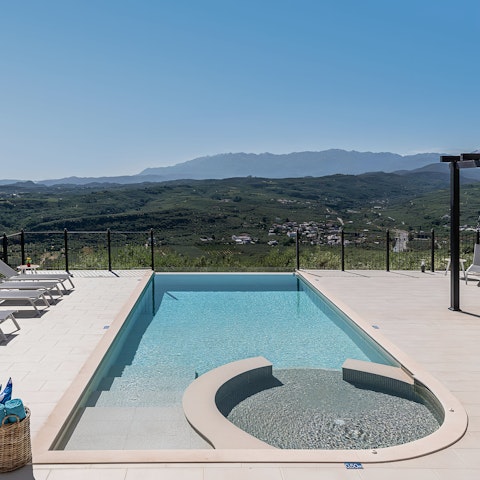 Admire countryside views from the private pool and Jacuzzi