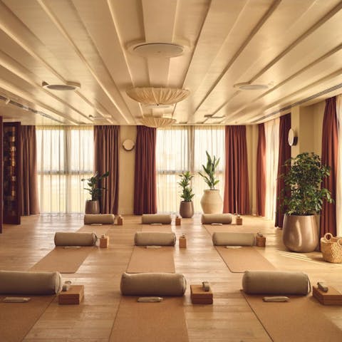 Enjoy complimentary yoga sessions in the serene and stylish yoga studio