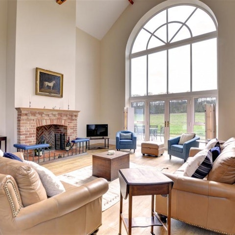 Gaze out into the garden through the impressive cathedral windows
