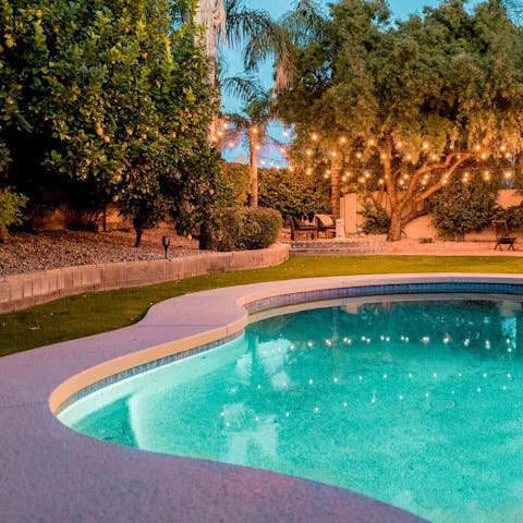 Take a sunset dip in the glow of fairy lights