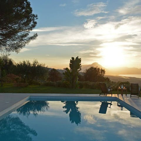 Watch the sunset while swimming