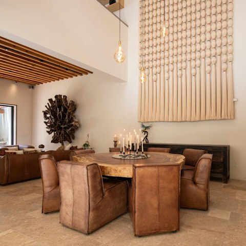 Dine beneath soaring ceilings in a room built for long evenings