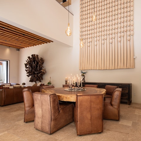 Dine beneath soaring ceilings in a room built for long evenings