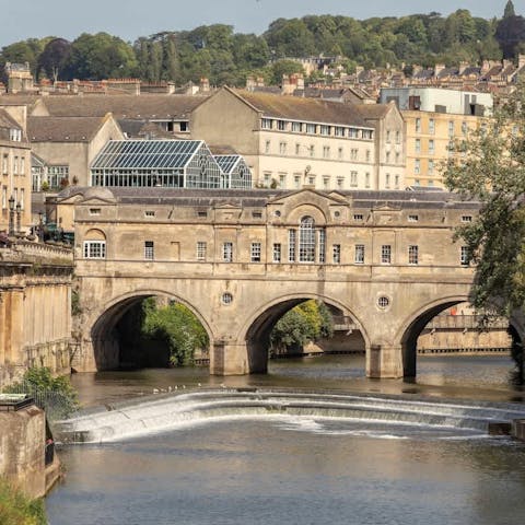 Stroll along the historic Town Bridge, dating back to the 13th century