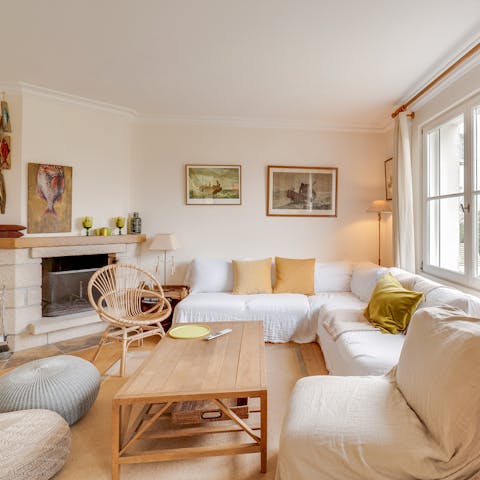 Spend rainy afternoons around the stone fireplace