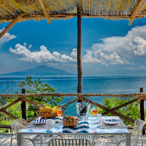 Dine alfresco on your private terrace with a showstopping view of Mt Vesuvius