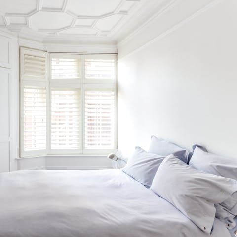 Fall asleep in the calming blue and white bedrooms