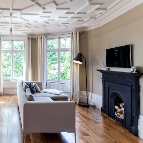 Kick back on the sofa with a glass of wine in the elegant living room