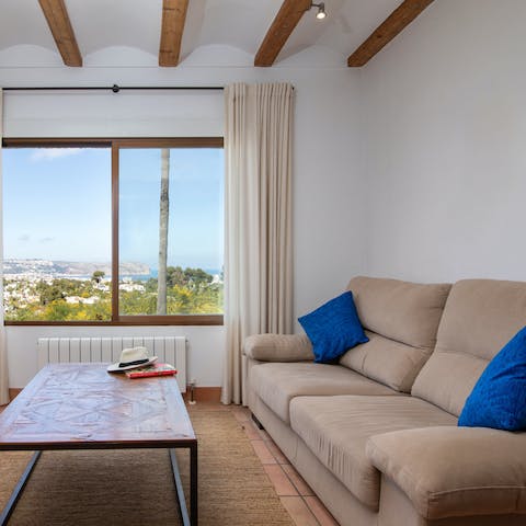 Snuggle up for some alone time on the comfy sofa, with magnificent views before you