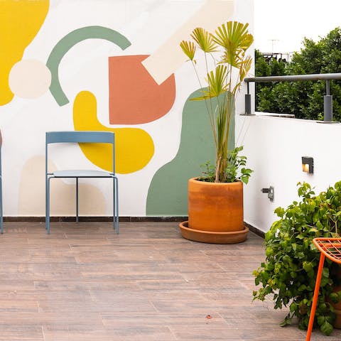 Enjoy a coffee at the shared rooftop garden