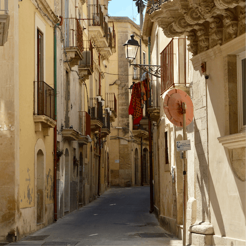Spend a day strolling through the charming streets of Catania, a 20km drive away