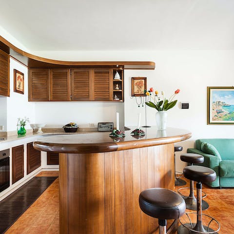 Mix an Aperol Spritz to sip at the retro wooden bar