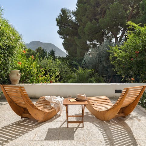 Drink in the view from the verdant garden