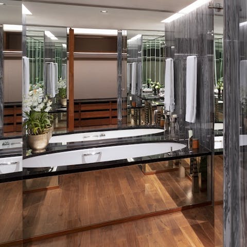 Indulge yourself in the luxurious bathroom, soaking in the bubbly waters of the deep tub