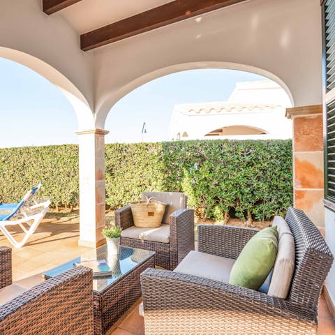 Unwind with a glass of wine on the covered terrace