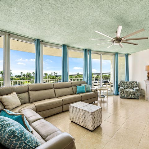 Stretch out on the giant corner sofa and look out at the view from the balcony
