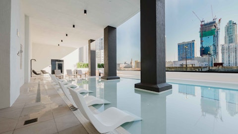 Cool off in the communal pool with city views