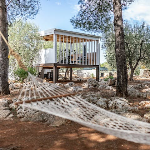 Catch some shade in the swinging hammock under the trees