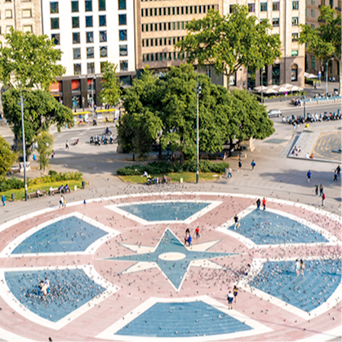 Watch the world go by from a cafe at Plaça de Catalunya