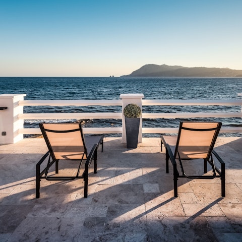 Chill out on the terrace and admire the sea views