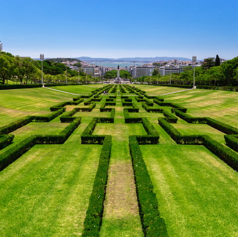 Stroll through the green beauty of nearby Parque Eduardo VII