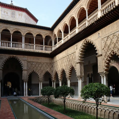 Explore the Royal Alcázar, a short walk away