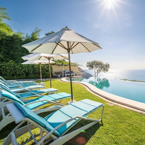 Stretch out by the pool and soak up those endless ocean views