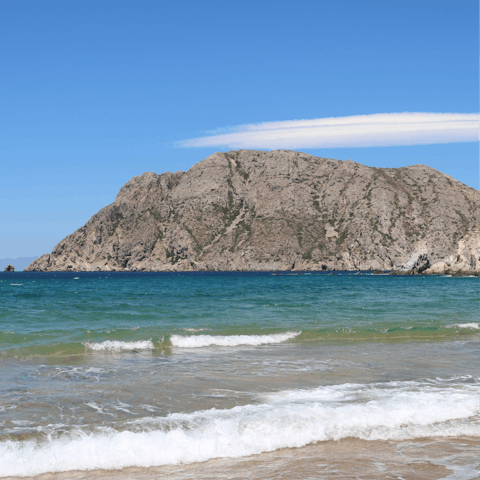 Drive five minutes to Kampos beach and feel the sand between your toes
