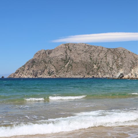 Drive five minutes to Kampos beach and feel the sand between your toes