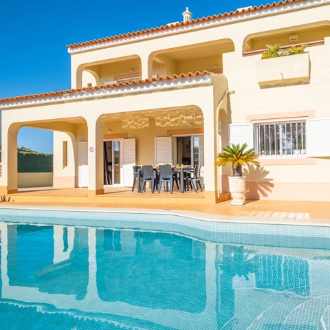 Unwind on the poolside loungers between soaking up the Algarve coastline