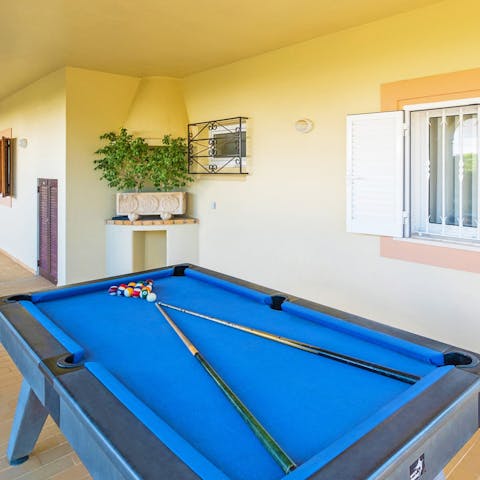 Get competitive at the games area with a Portuguese aperitif in hand