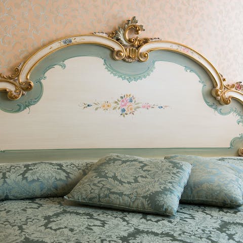Enjoy a restful night's sleep in the magnificent gilded bed